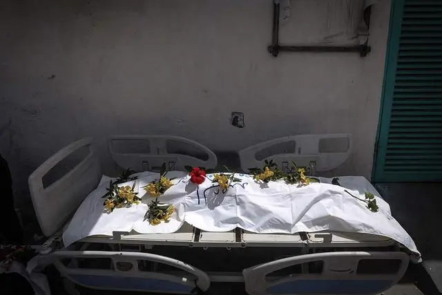 加沙医院乱葬坑现数百具遗体_遗体在医院存放时间规定_遗体埋葬